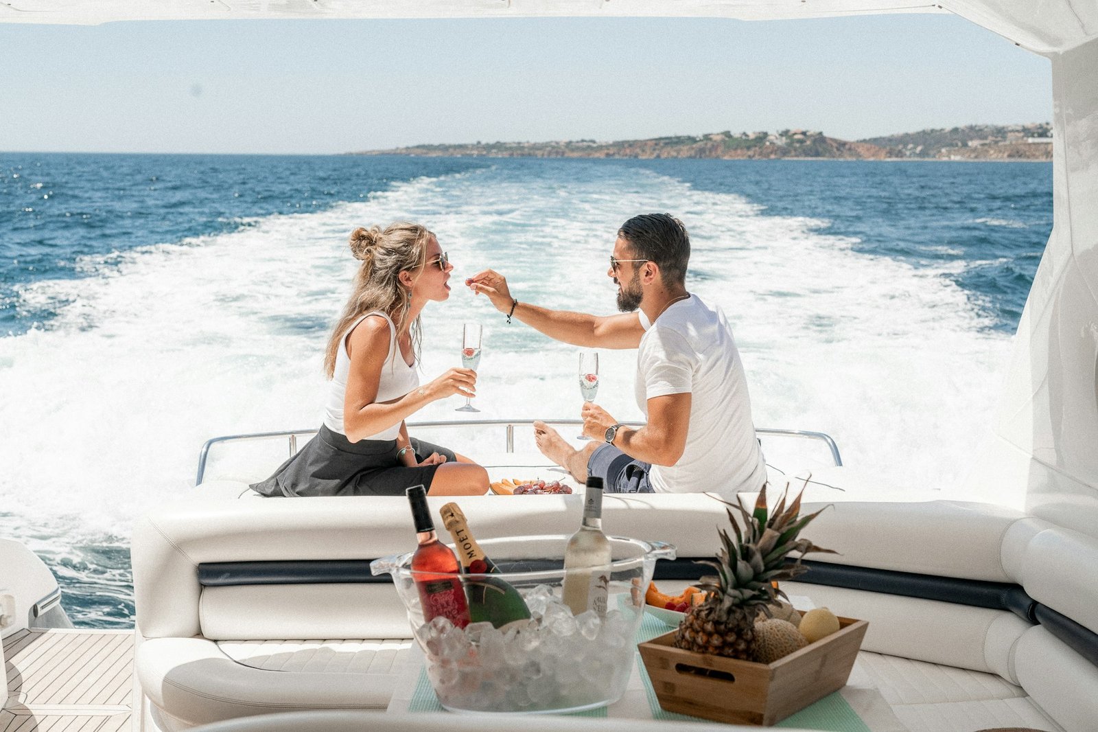 Couple sharing a celebration on the deck of a boat in Dubai