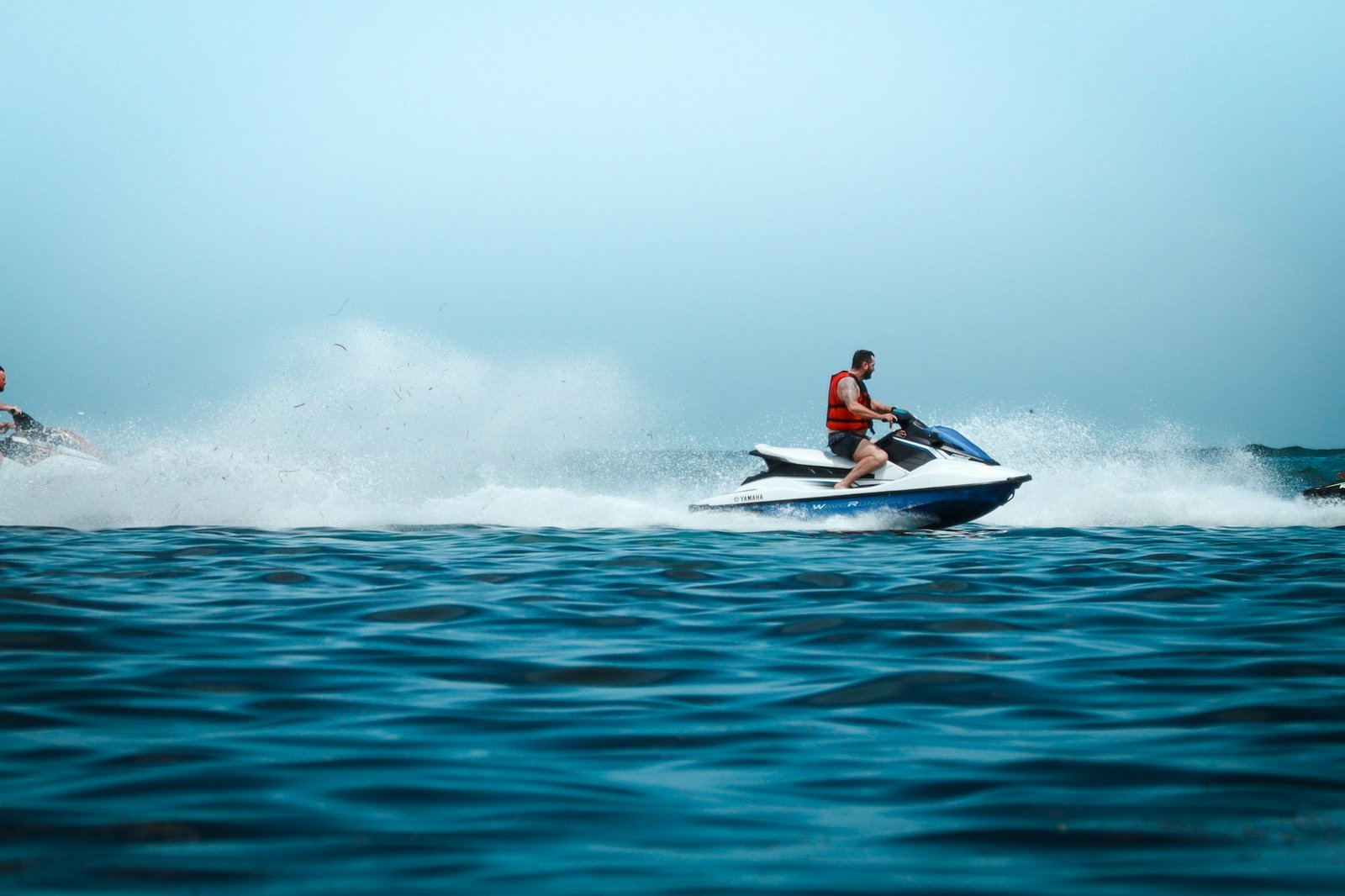 Rider speeding across open water off the Dubai coast