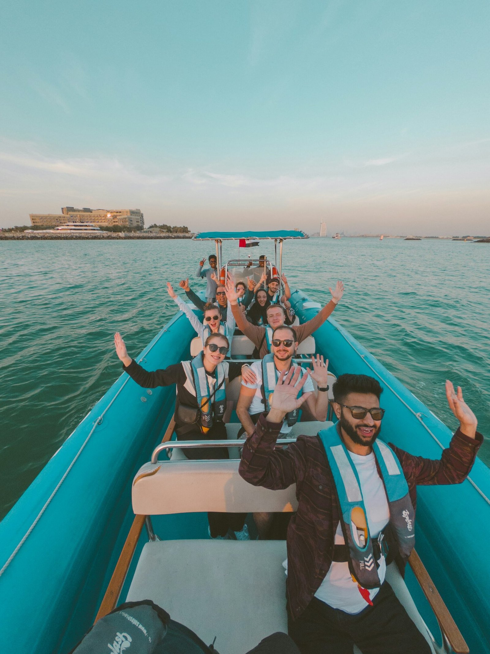 Group enjoying a speedboat ride on the water in Dubai