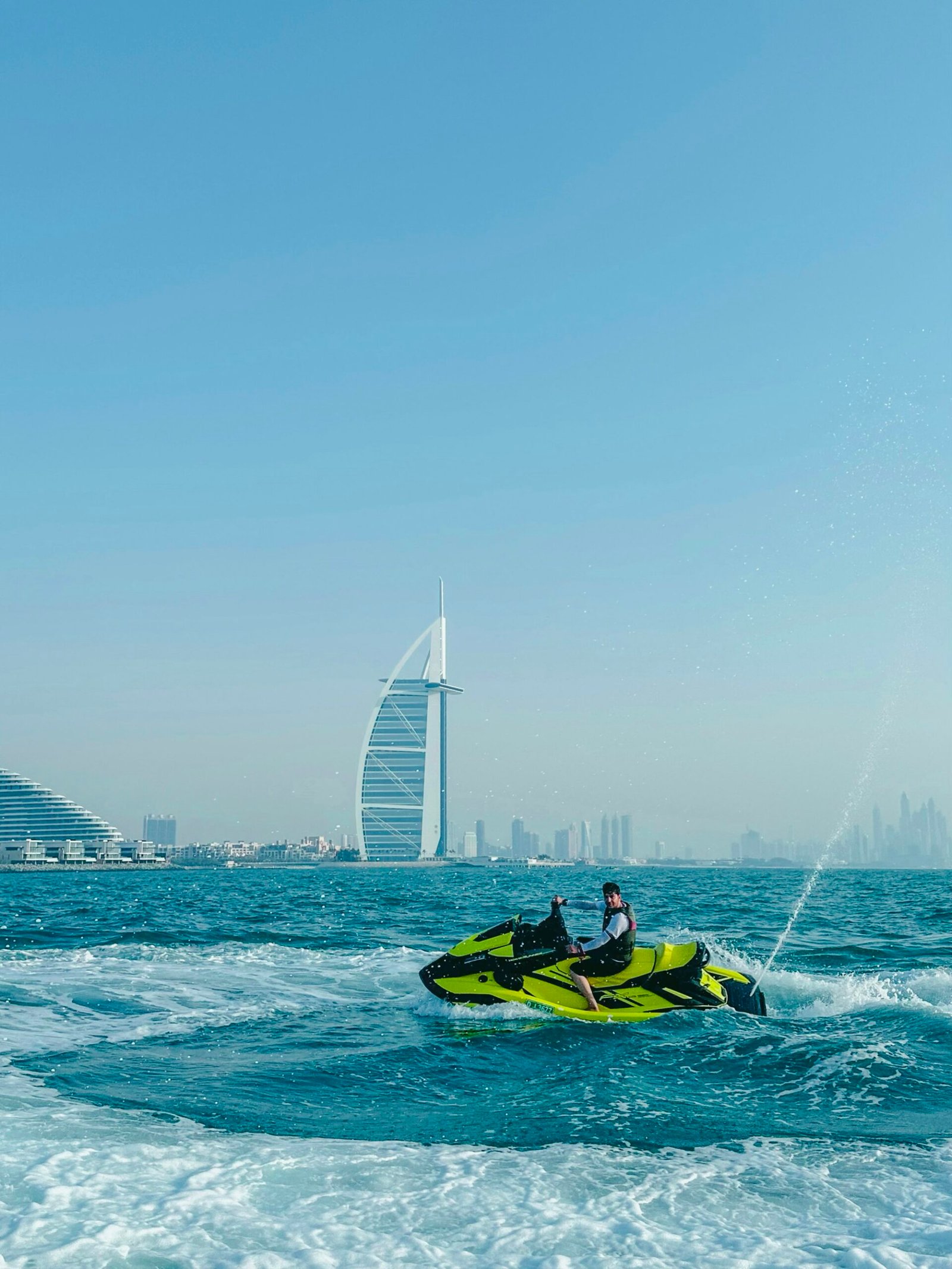 Jet ski on the water in front of Burj Al Arab, Dubai
