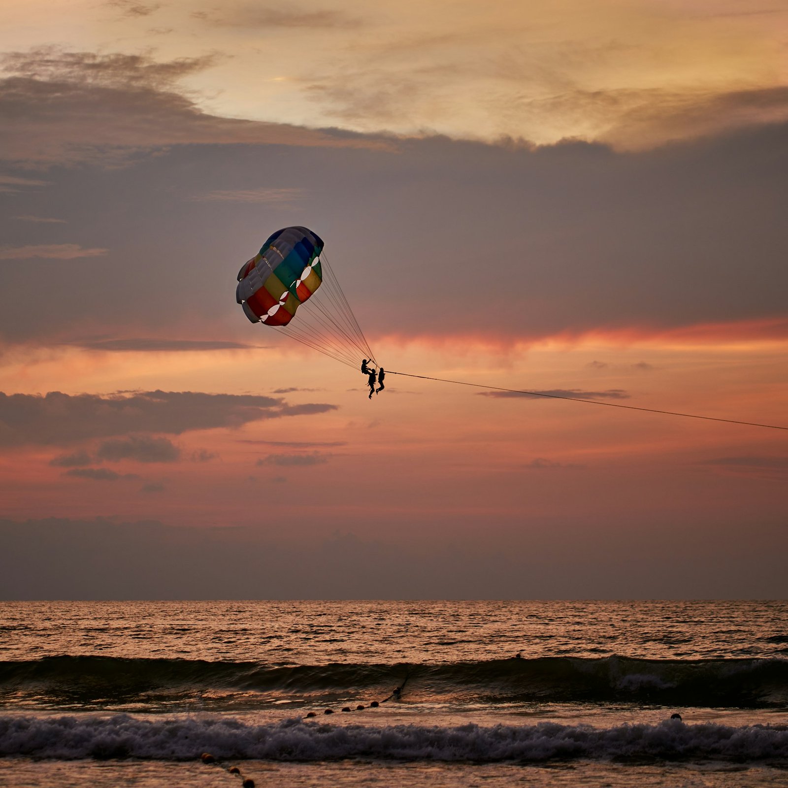 Parasailing at sunset over the Arabian Gulf