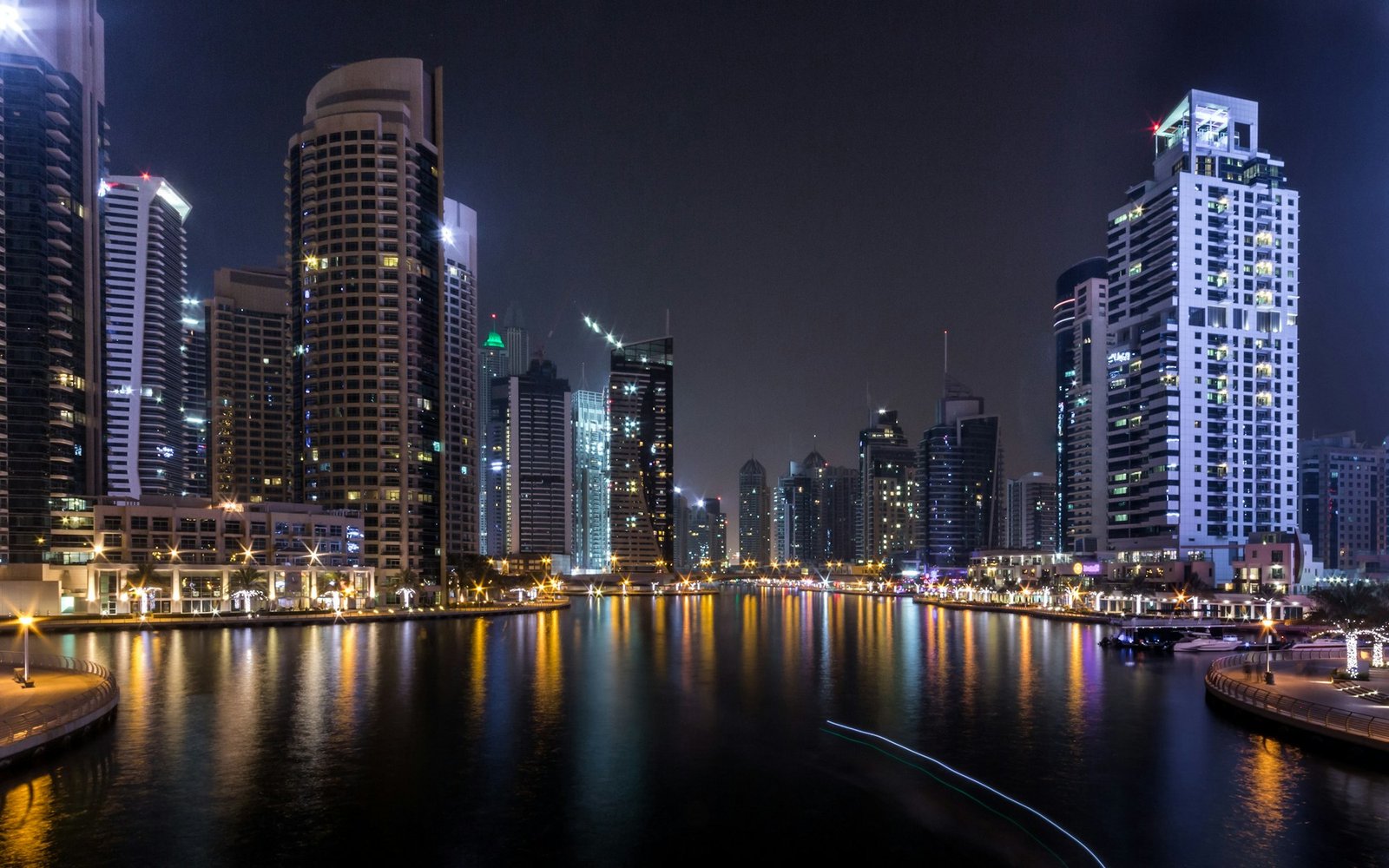 Dubai Marina skyline and waterfront lit up at night